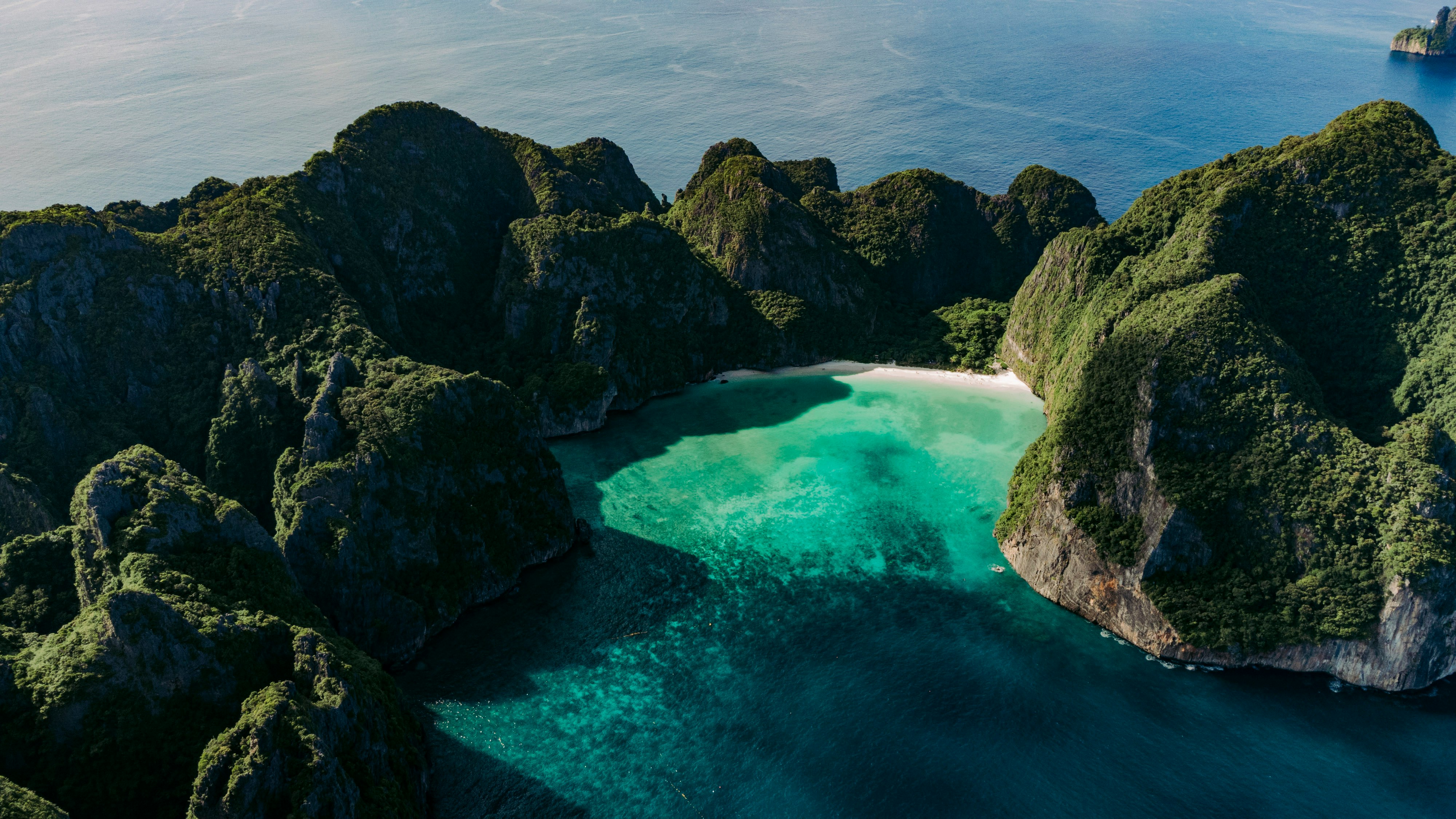Phuket aerial coast — limestone karst and turquoise water